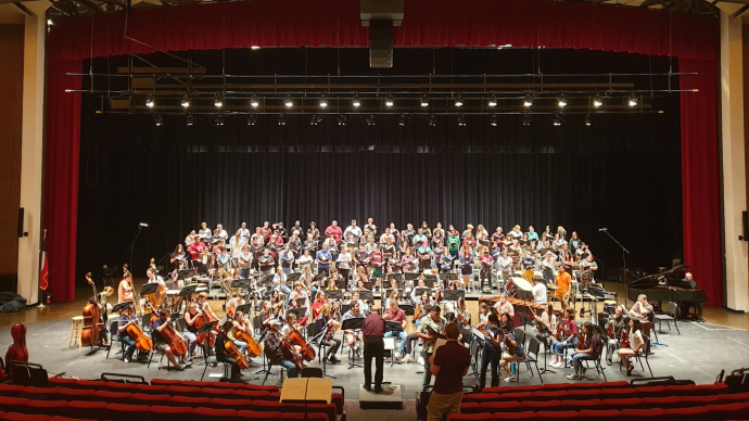 a wide shot of the choir and orchestra on stage at Trinity's 2023 Choral Union Concert